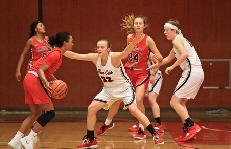 Shayla Newman and Maddie Strom playing defense. 