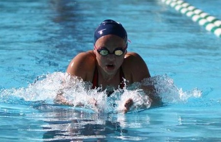 Sophomore Michelle Spratt swims the breaststroke leg of the 400 IM in which she finished 3rd.  Spratt also won the 1650 free and took 4th in the 500 free at the Cuesta Invitational.  Photo:  Debi Pettit