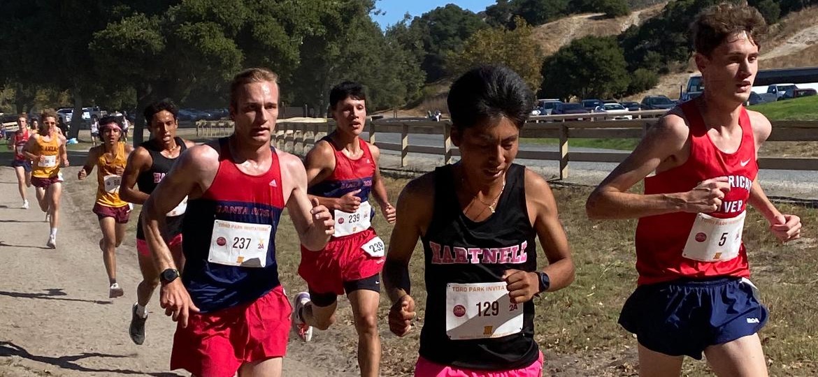  Luke Baird and Adrian Estrada make their way through the pack in the final mile of the NorCal Preview at Toro Park in Salinas.
