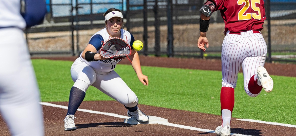 First baseman, Sofia Uricoechea, receives the throw to put out the runner.